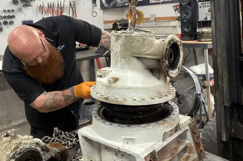Brooksville, FL transmission rebuild specialists RDI Power. Mechanic at the shop rebuilding a diesel transmission.