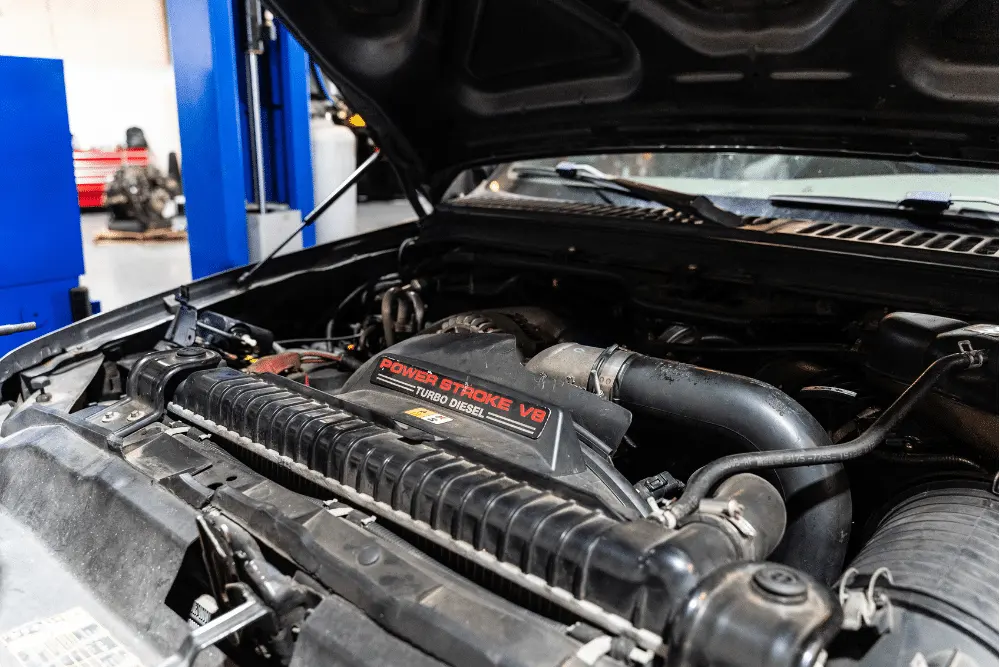 diesel engine maintenance, diesel repair in Brooksville, FL at RDI Power. Close-up of a Power Stroke V8 Turbo Diesel engine in a pickup truck being checked in a diesel repair shop.