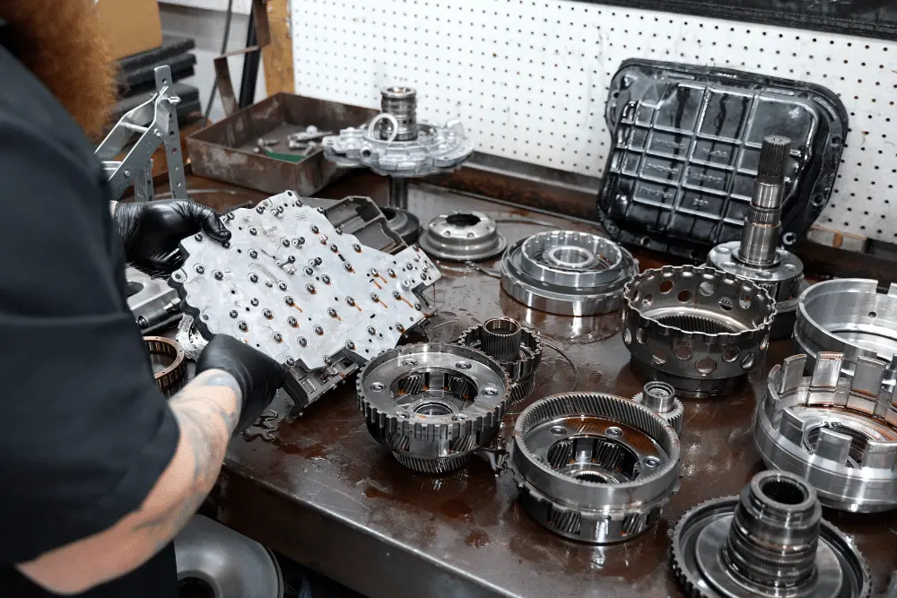 diesel transmission, diesel repair in Brooksville, FL at RDI Power. Close-up of disassembled transmission parts being inspected for wear and prepared for reassembly.