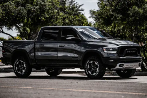 Beat the Heat with Regular AC Service and Repair with RDI Power in Brooksville, FL. image of black dodge ram diesel, 4 door pick up pictured outside in summer heat