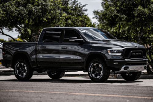 Beat the Heat with Regular AC Service and Repair with RDI Power in Brooksville, FL. image of black dodge ram diesel, 4 door pick up pictured outside in summer heat