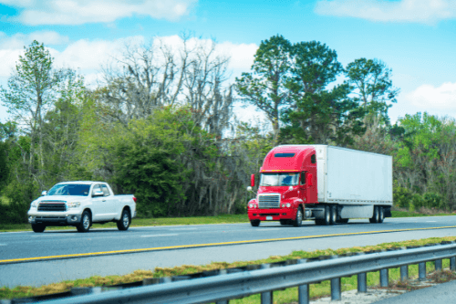 Florida Fall Car Care for Diesels, RVs, and Fleet Vehicles with RDI Power in Brooksville, FL; image of pickup truck and big rig truck driving on highway in Florida