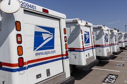 The Guide to Creating a Fleet Maintenance Checklist with RDI Power in Brooksville, FL. image of a fleet of parked United States Postal Service trucks