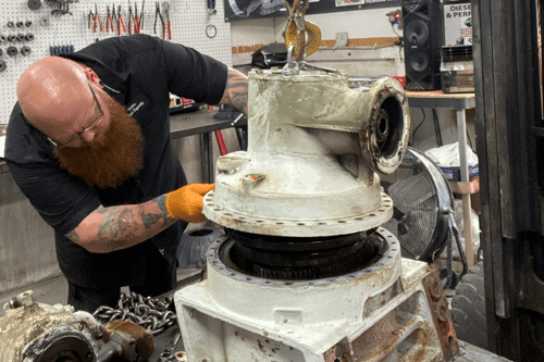 Brooksville, FL transmission rebuild specialists RDI Power. Mechanic at the shop rebuilding a diesel transmission.